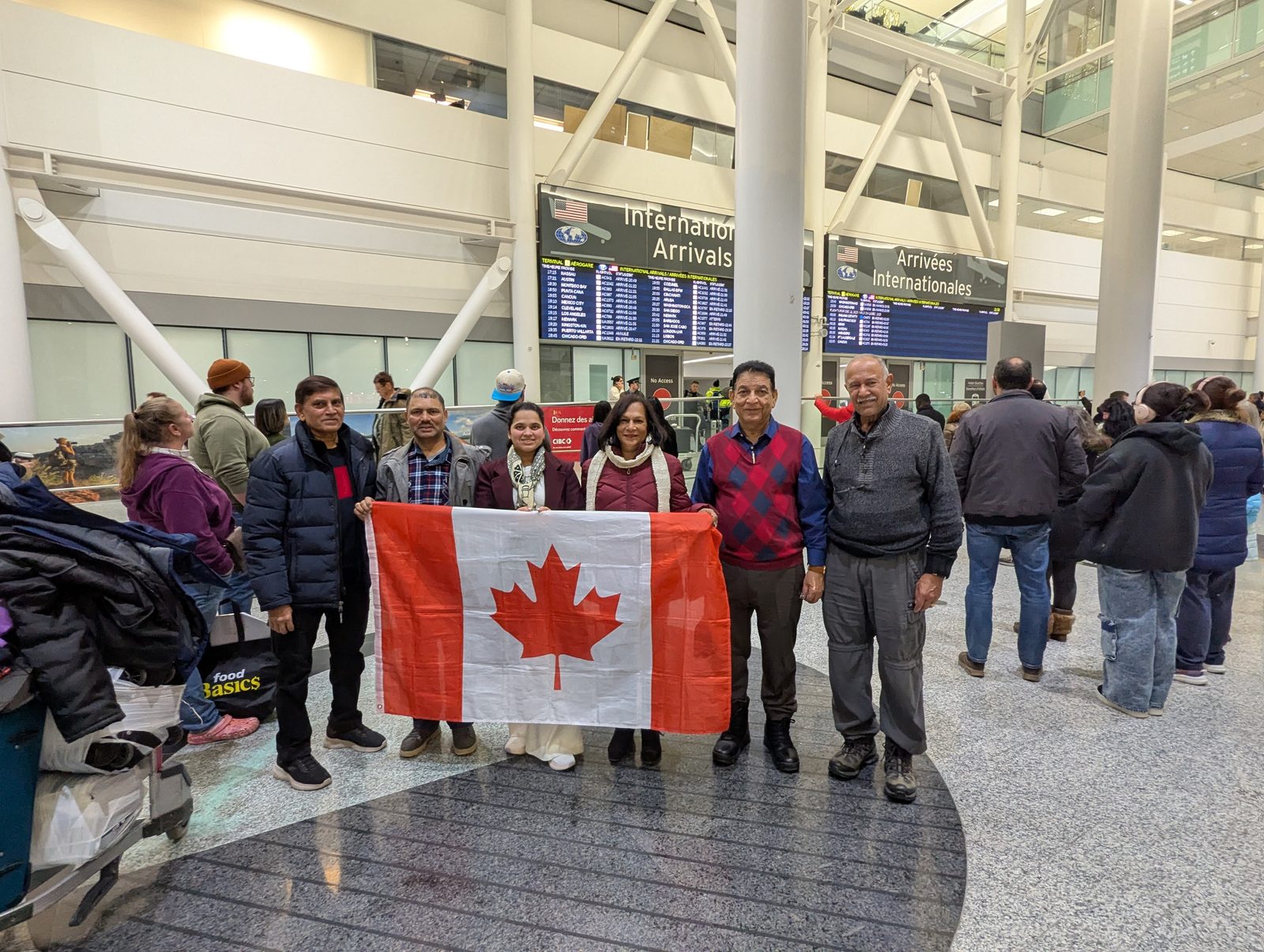 Michael D'Souza and his daughter Rochelle arriving at Toronto Pearson